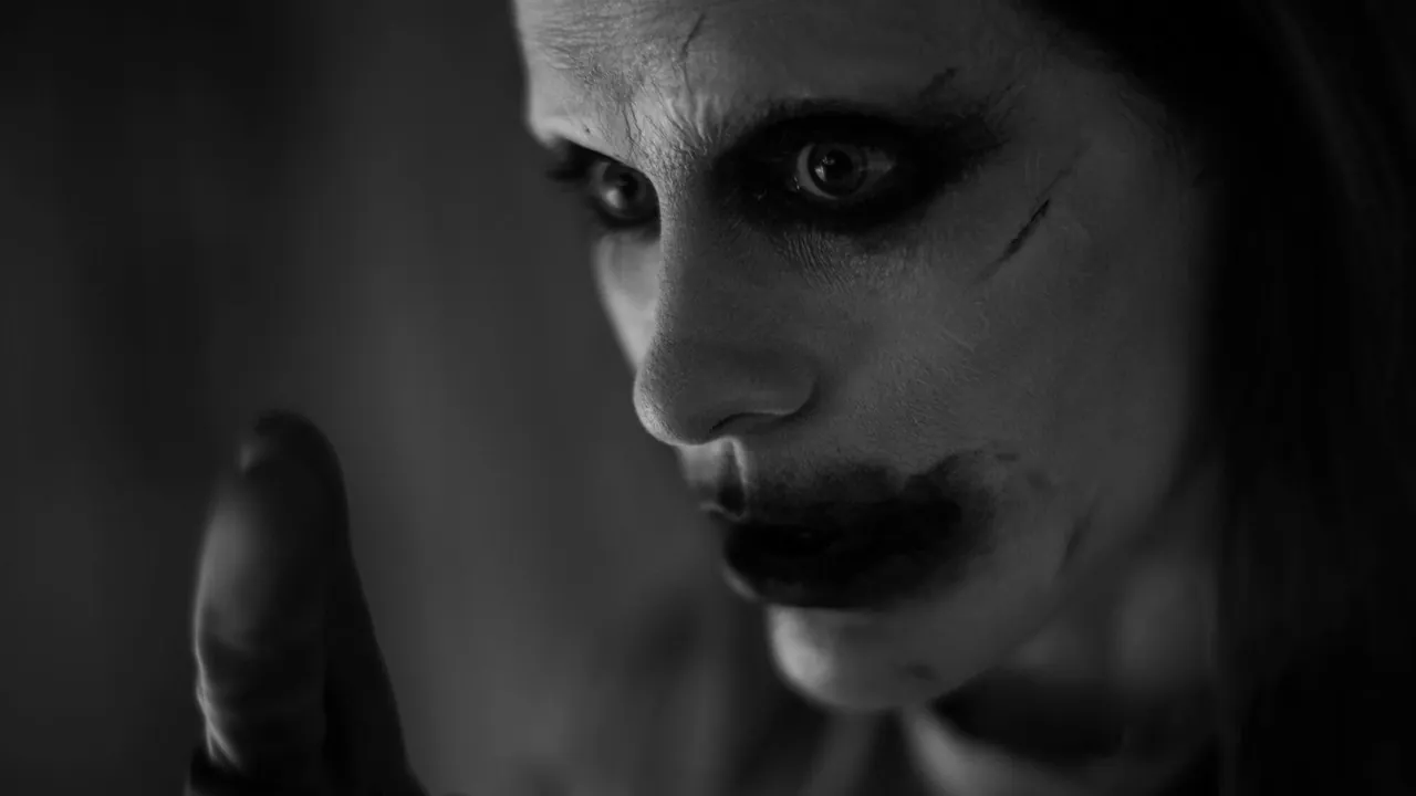 The Joker in close-up, in Batman's nightmare, in an official still from Zack Snyder's cut of Justice League